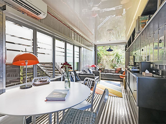 The converted refrigerated container makes a cozy living area. Source: NZ Herald