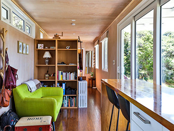 Timber floors and cozy furnishings make for a homely interior. Source: livingbiginatinyhouse.com